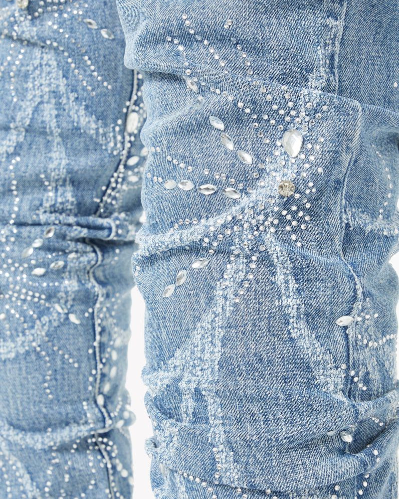 Close-up of a denim jeans with rhinestone embellishments