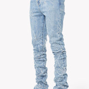 Light blue distressed jeans worn by a person on a white background