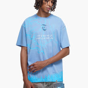 Person wearing a light blue t-shirt with text and graphics on a white background