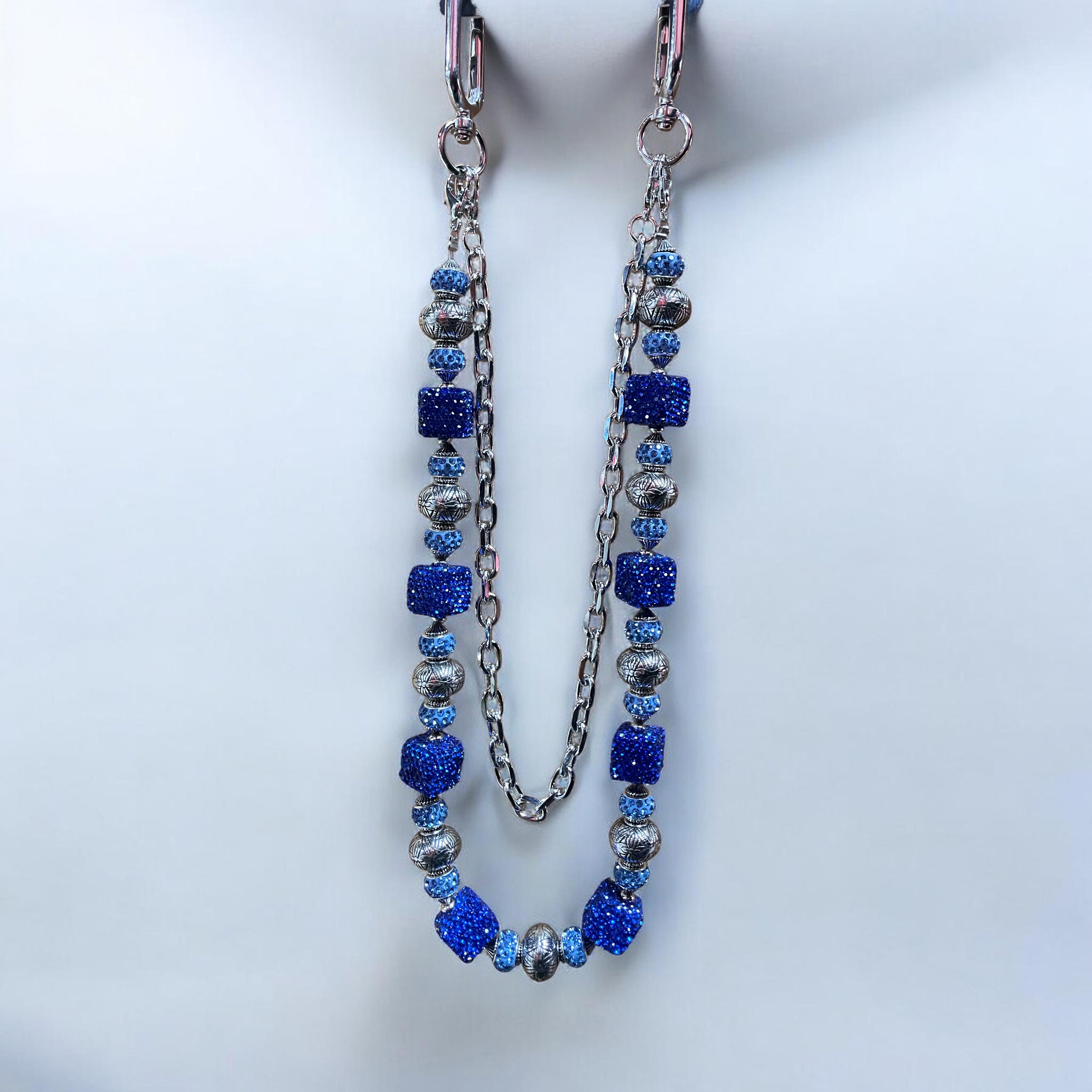 wallet chain with blue and silver beads on a white background