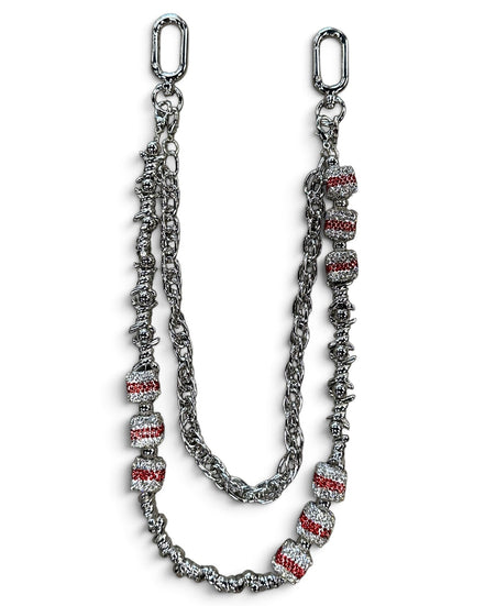 A silver-toned chain accessory with textured links and multiple cylindrical beads set with clear stones and red inlay, displayed on a white background.
