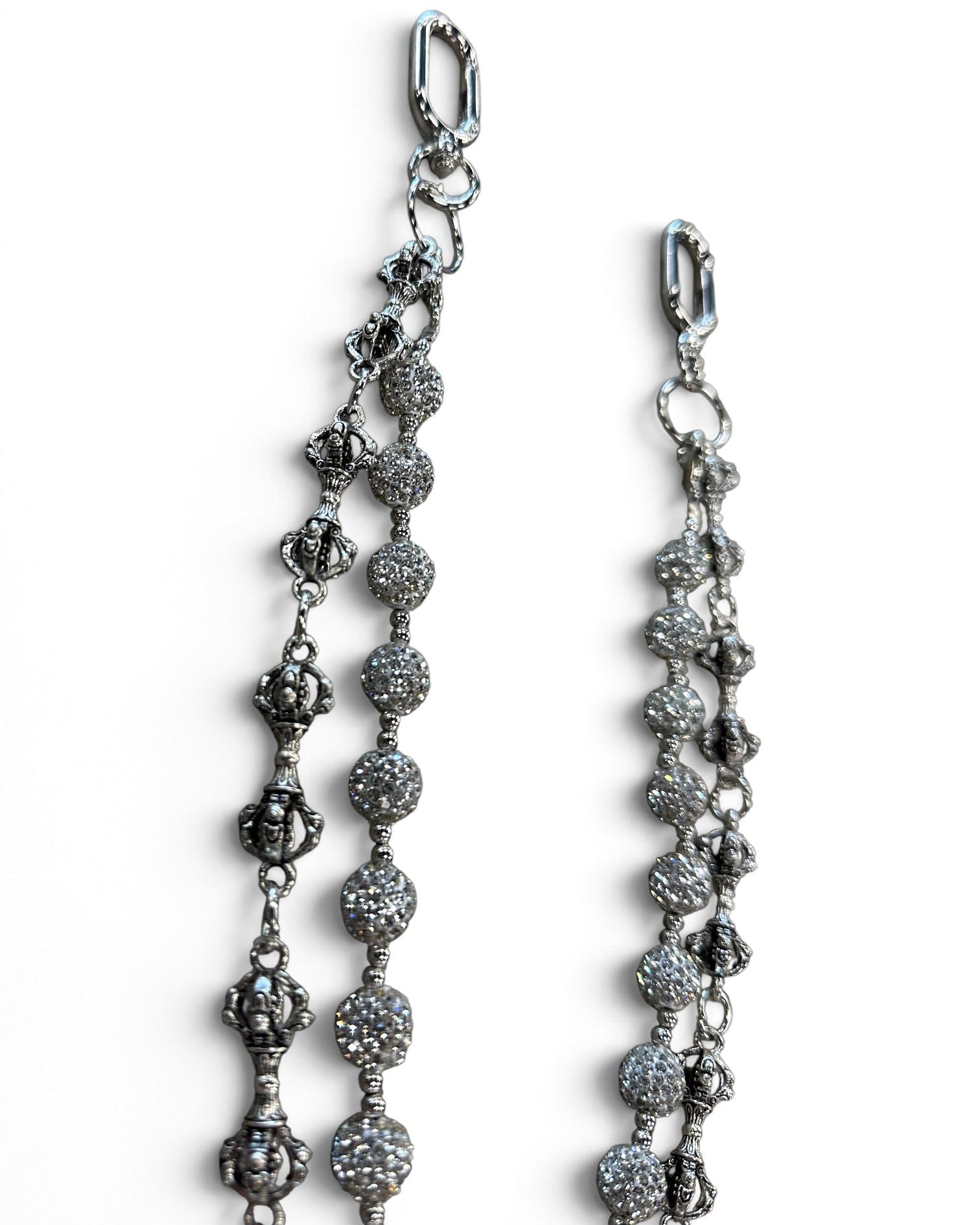 A close-up of a silver-toned beaded chain accessory with textured round beads and lobster clasp ends, shown on a plain white background.