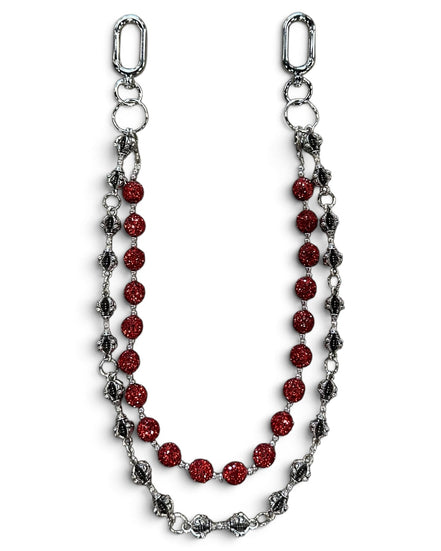 A silver-toned chain accessory featuring a central strand of faceted red beads and flanking strands of textured silver and dark metallic links, displayed on a clean white background.