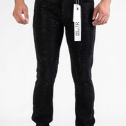 Black jeans with a visible brand tag on a white background