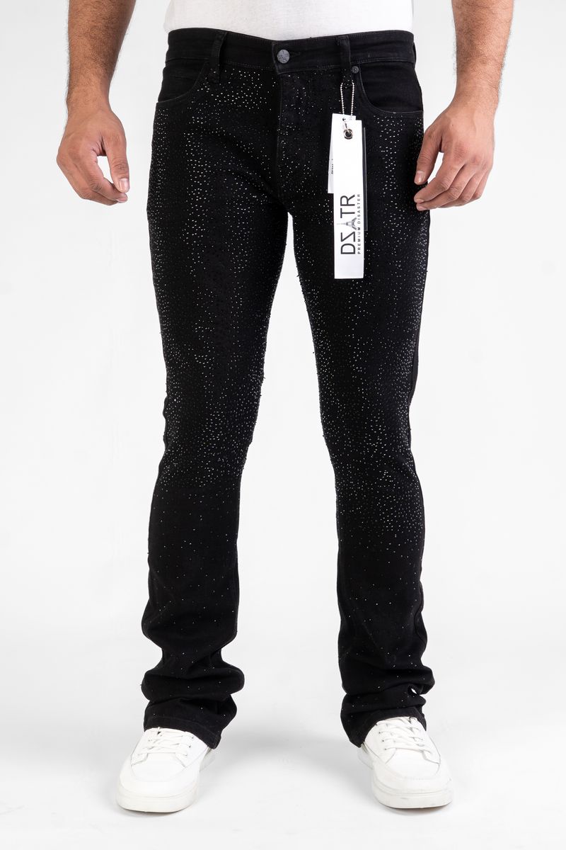 Black jeans with a visible brand tag on a white background