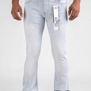 Light blue jeans with a brand tag on a white background