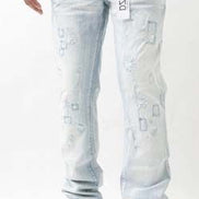 Light blue distressed jeans worn by a person on a white background