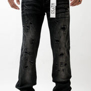 Black distressed jeans with a visible brand label on a white background