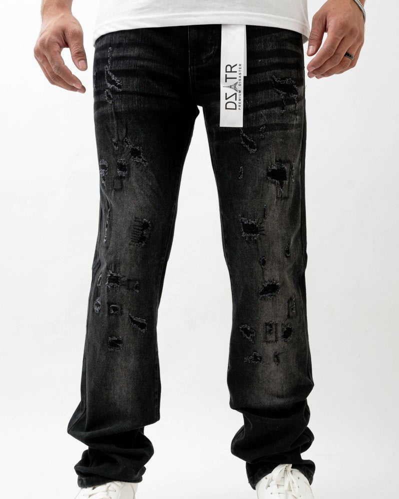 Black distressed jeans with a visible brand label on a white background