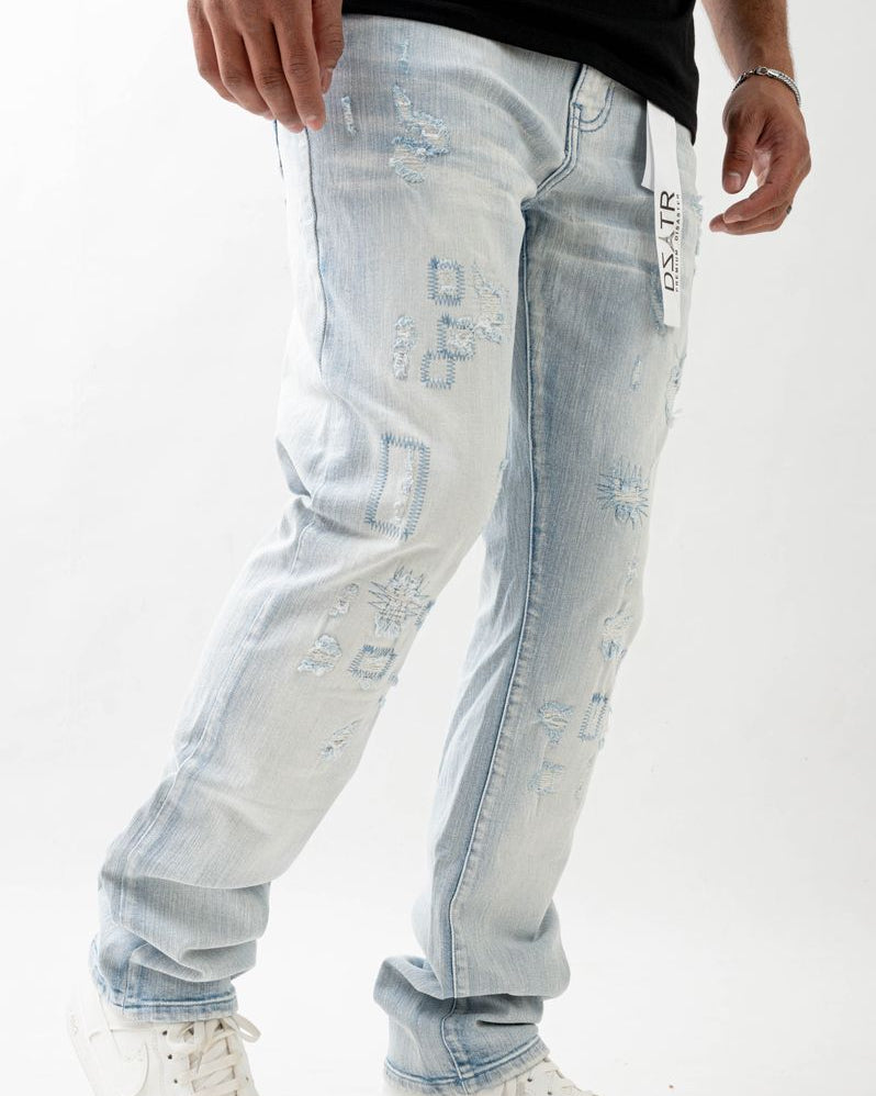 Light blue distressed jeans with a brand logo on a white background