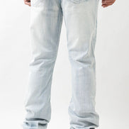 Light blue jeans worn by a person on a white background