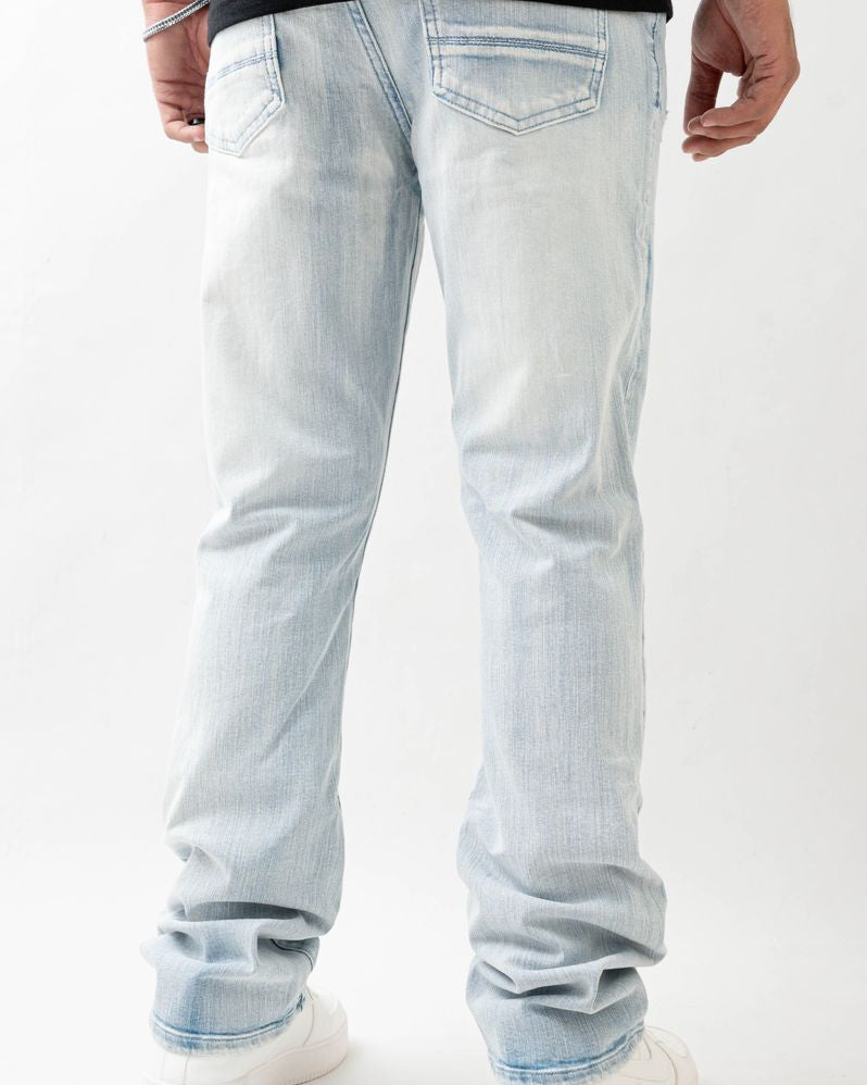 Light blue jeans worn by a person on a white background