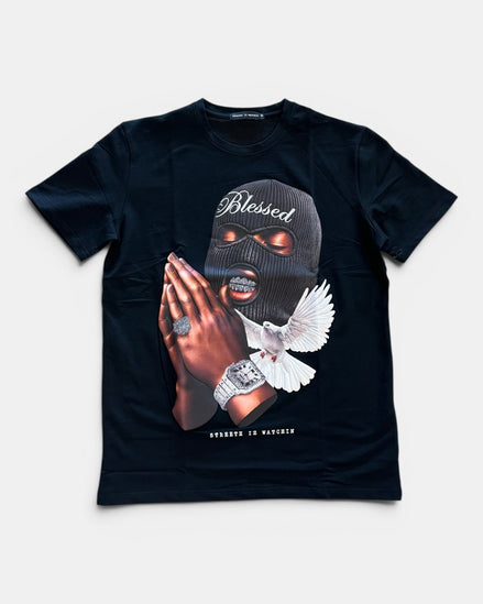 Black t-shirt with graphic design of hands in prayer, dove, and text on a white background