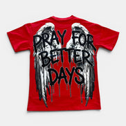 Red t-shirt with black text 'Pray for Better Days' and wings on a white background