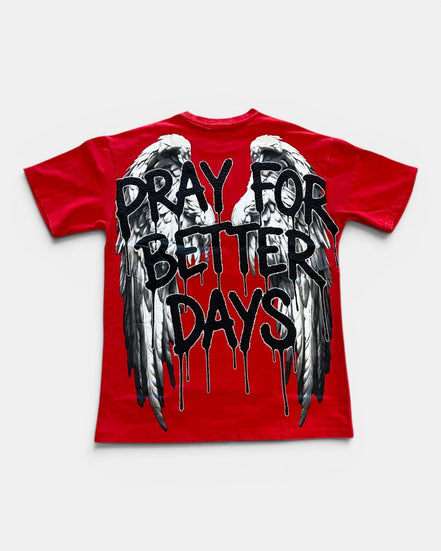 Red t-shirt with black text 'Pray for Better Days' and wings on a white background