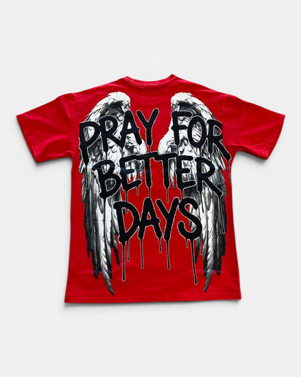 Red t-shirt with black text 'Pray for Better Days' and wings on a white background