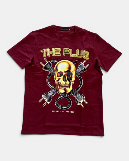 Maroon t-shirt with a graphic design of a skull and power plugs on a white background