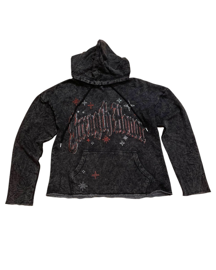 Black hoodie with branding on a white background