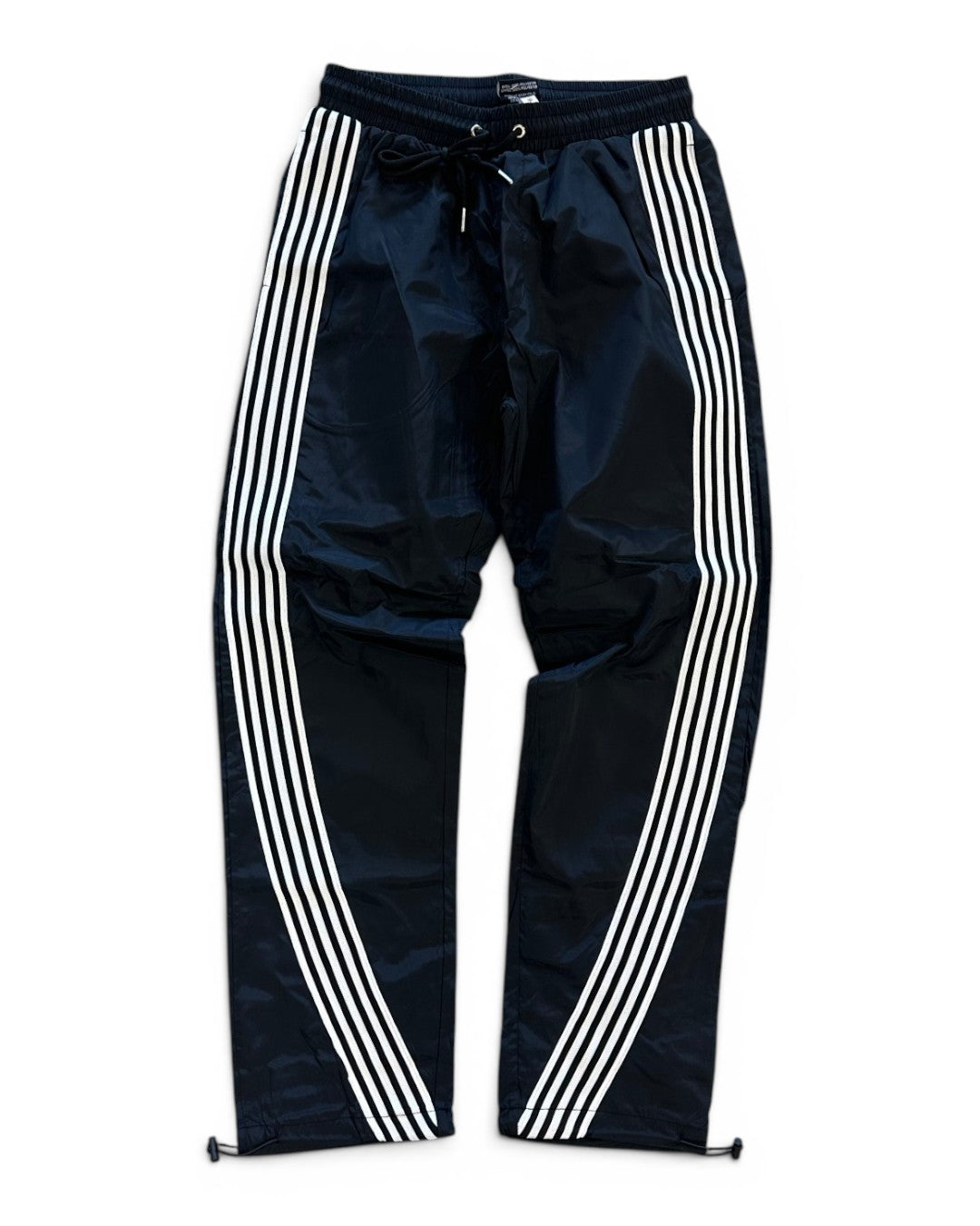 Black pants with white stripes on a white background