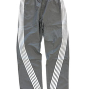 Gray track pants with white diagonal stripes running down the sides, featuring an elastic waistband and drawstring.