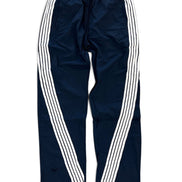 Navy blue track pants with three white stripes running down the sides, featuring an elastic waistband and drawstring.