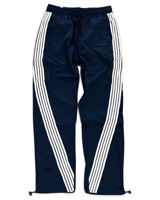 Navy blue track pants with three white stripes running down the sides, featuring an elastic waistband and drawstring.