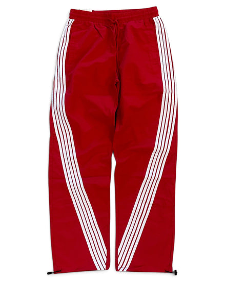 Red track pants with white diagonal stripes running down the sides, featuring an elastic waistband and drawstring.