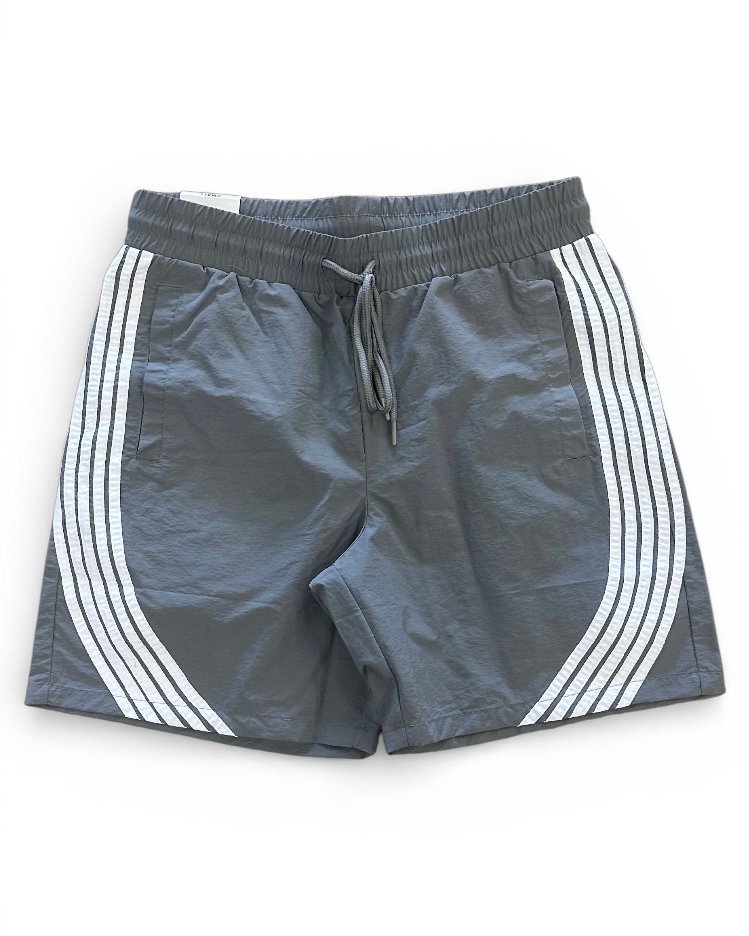 Gray shorts with white stripes on a white background