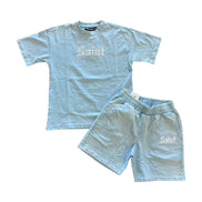 Light blue t-shirt and shorts set with branding on a white background