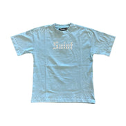 Light blue t-shirt with 'Saint' text on a white background