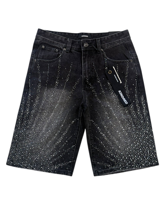 Black denim shorts with starburst pattern on a white background