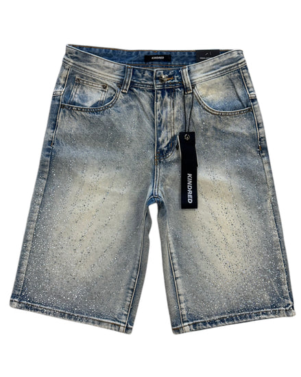 Blue denim shorts with a brand tag on a white background