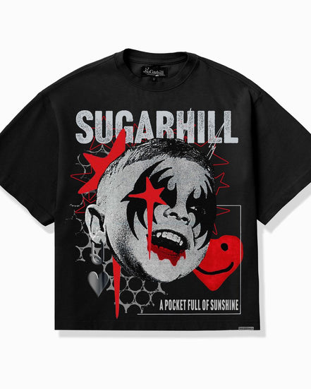 A black short-sleeve graphic t-shirt featuring a stylized clown face with red paint details, the word 'SUGARHILL' in distressed white letters, and a red smiley face on the front.
