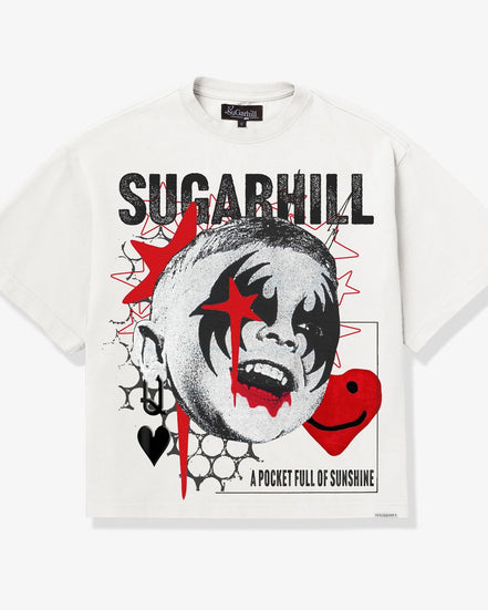 A white short-sleeve graphic T-shirt featuring a stylized black-and-white clown face with red star and heart accents, plus the text 'SUGARHILL' and 'A POCKET FULL OF SUNSHINE' on a clean white background.