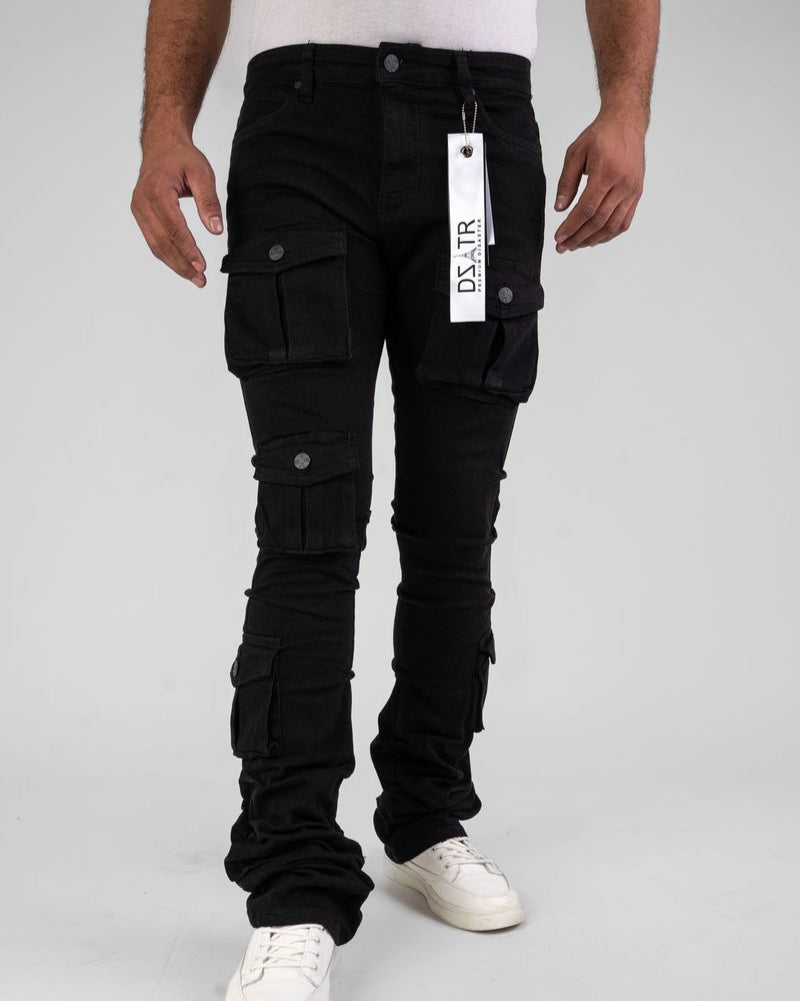 Person wearing black cargo pants with a visible brand tag on a white background