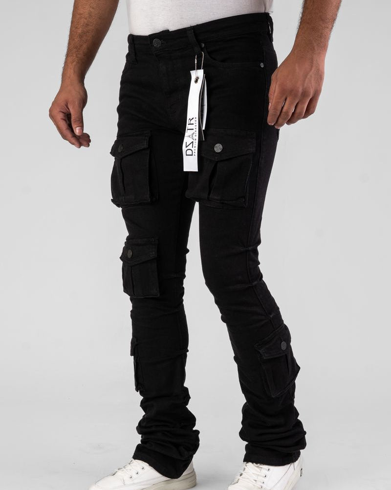 Person wearing black cargo pants with a visible brand tag on a white background