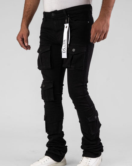 Person wearing black cargo pants with a visible brand tag on a white background