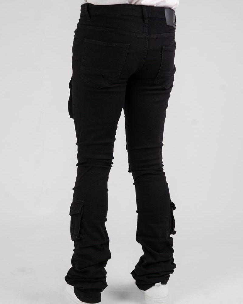 Black pants worn by a person on a gray background