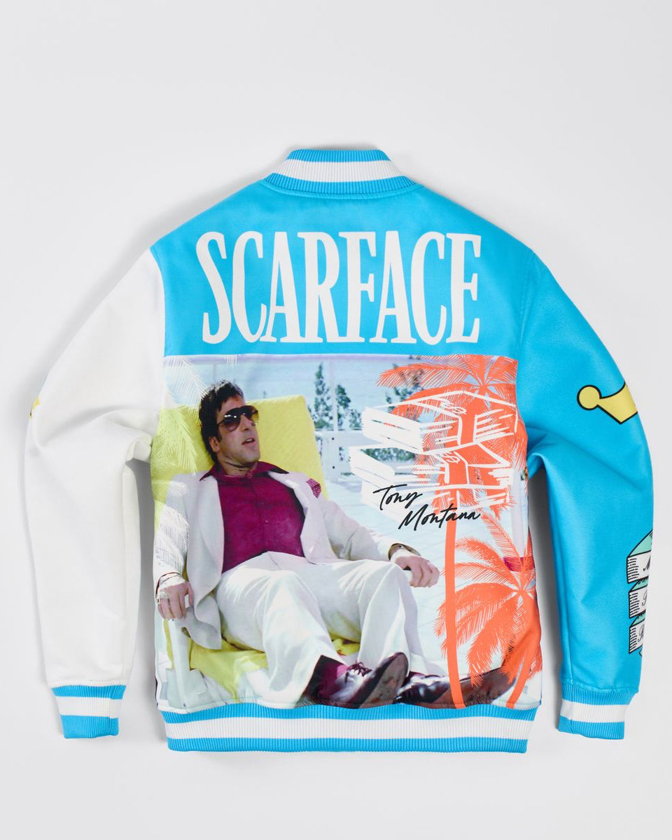Varsity jacket with 'Scarface' design featuring a person lounging on a chair.