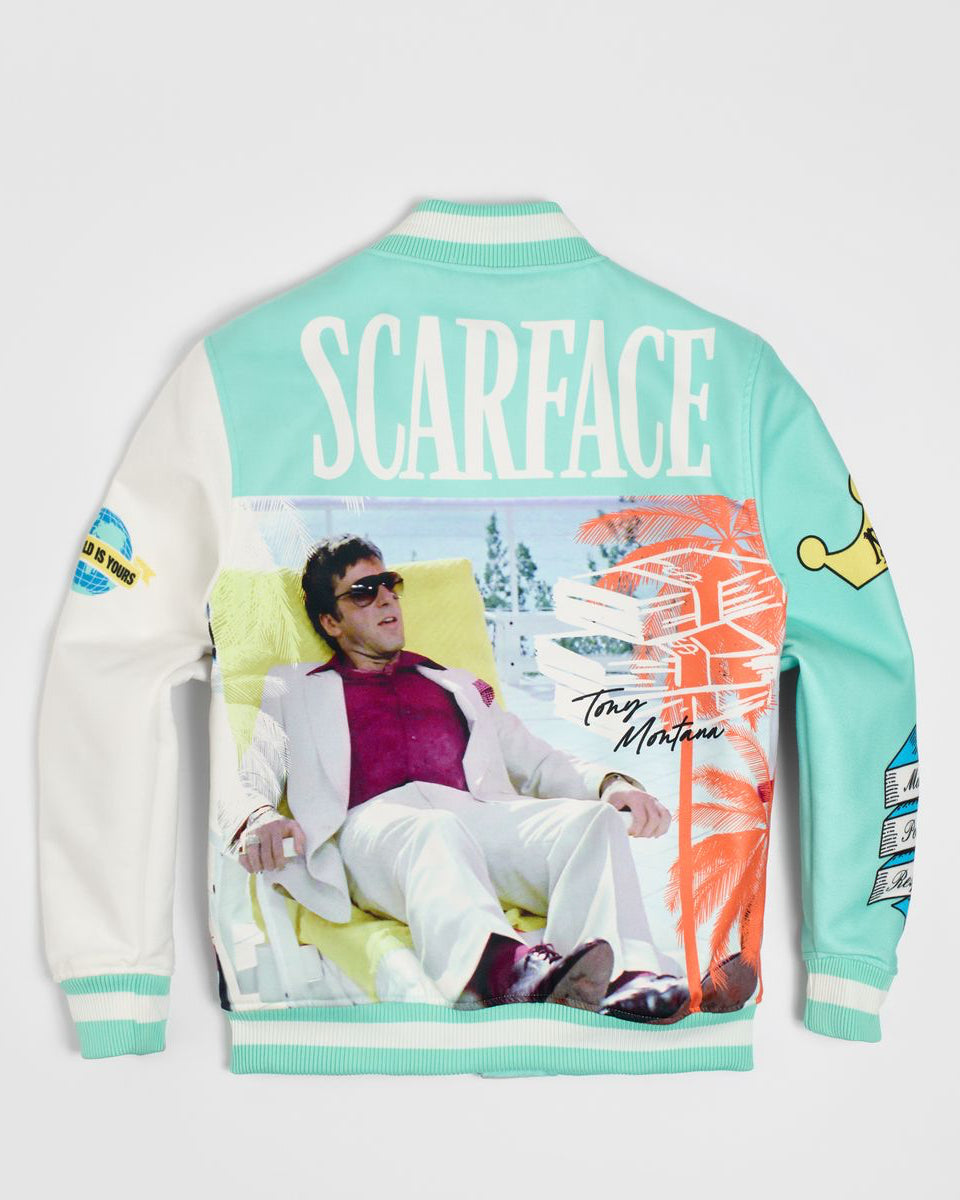 Varsity jacket with 'Scarface' design featuring a person lounging on a beach chair.