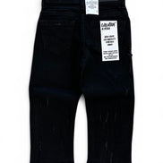 Black toddler jeans with distressed details, shown from the back with retail tags attached, on a white background.