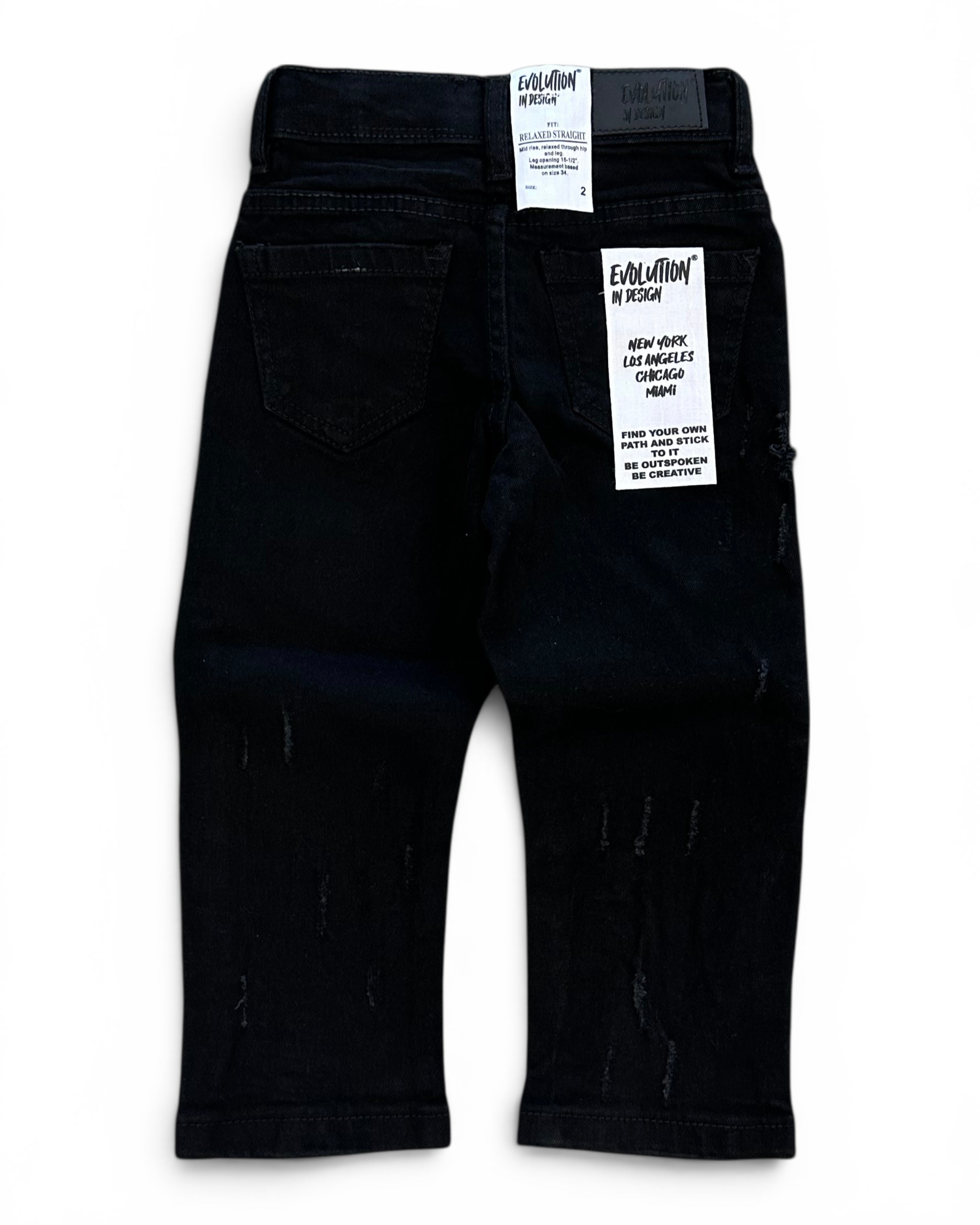 Black toddler jeans with distressed details, shown from the back with retail tags attached, on a white background.