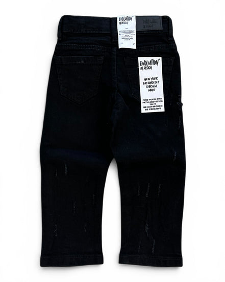 Black toddler jeans with distressed details, shown from the back with retail tags attached, on a white background.