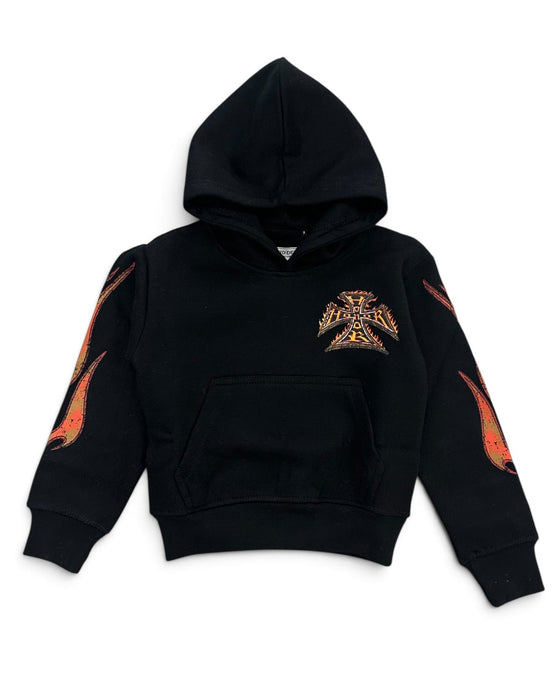 A black cropped pullover hoodie featuring a stylized metallic gold and orange Iron Cross emblem on the left chest, with matching flame-like graphic prints on both sleeves.