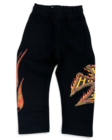 Black sweatpants with orange and yellow flame graphics on the left leg and right leg, featuring an elastic waistband.