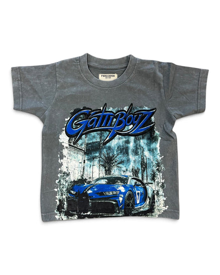 A kids' gray short-sleeve t-shirt featuring a blue and black 'GATTI BOYZ' script logo across the chest, with a graphic of a blue sports car in front of a city scene below.