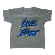 A gray acid-wash short-sleeve t-shirt with a large blue and black 'Live Fast' graphic printed on the back, shown against a plain white background.