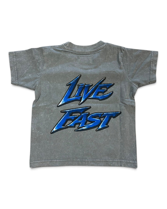 A gray acid-wash short-sleeve t-shirt with a large blue and black 'Live Fast' graphic printed on the back, shown against a plain white background.