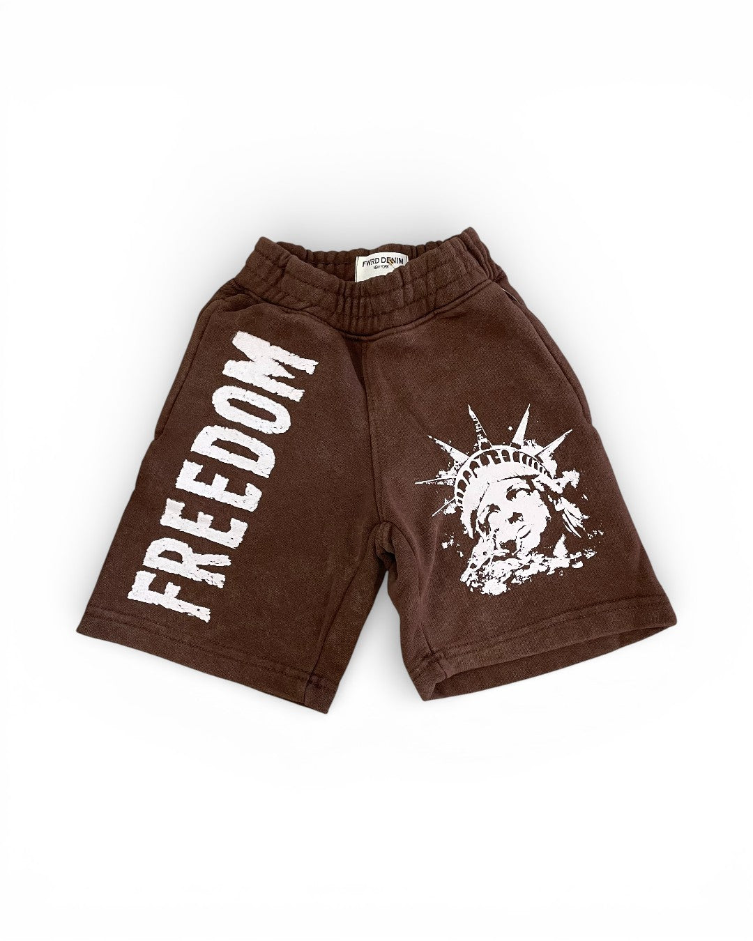 Brown shorts with 'FREEDOM' text and graphic design on a white background