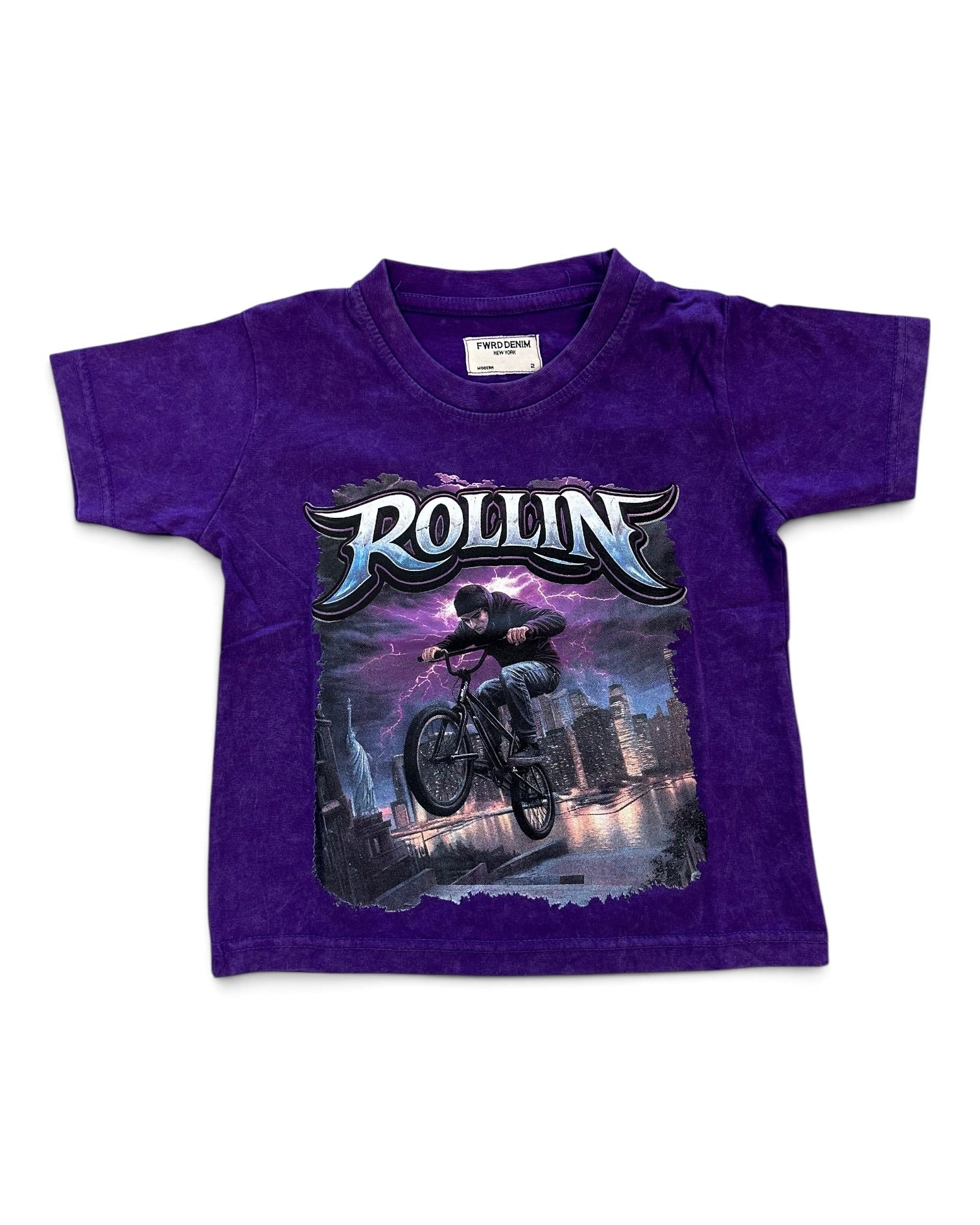 A purple short-sleeve kids' t-shirt featuring a large graphic print of a BMX rider with the word 'ROLLIN'' in stylized lettering, displayed flat against a white background.